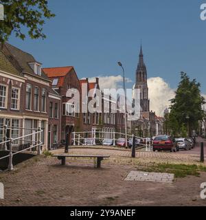 Street with canal in old town of Delft in sommer time, Holland Stock Photo