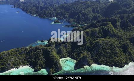 Aerial view of tropical Coron island in Philippines. Blue lagoons and lakes, white sand beach, rocks cliffs mountains and beautiful coral reef Stock Photo