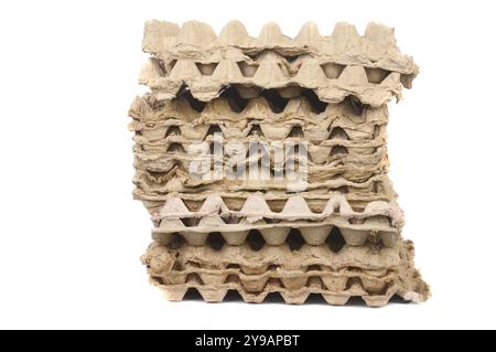 pile of egg cartons on white background Stock Photo