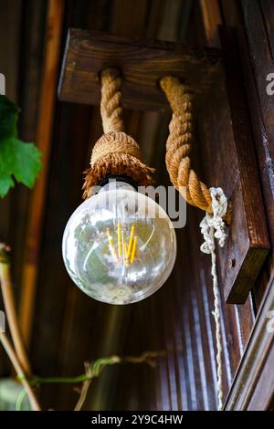 Rustic ceiling lamp with rope detail Stock Photo