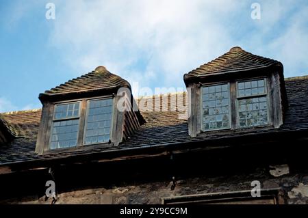 Windows in the roof of one of the remaining buildings of the Charterhouse, a former Carthusian monastery, Smithfield, City of London, England,  UK Stock Photo