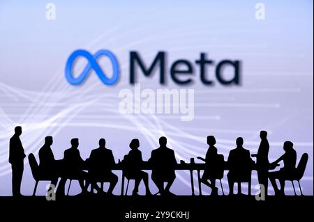 CALIFORNIA, USA, OCTOBER 10, 2024: Meta Company Bussiness meeting. Silhouette of business people sitting behind the table and discussing. Stock Photo