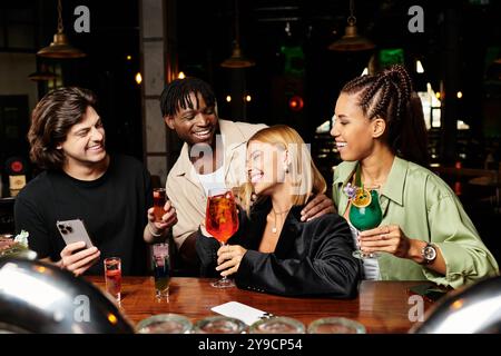 Young professionals enjoy drinks and laughter at a vibrant corporate party atmosphere. Stock Photo