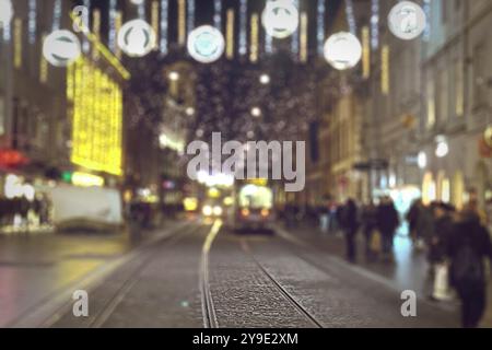 Blurry image of city street decorated with festive lights for Christmas. Conceptual abstract background image of defocused Christmas decoration on cit Stock Photo
