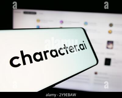 Mobile phone with logo of Character Technologies Inc. (Character.ai) on screen in front of business website. Focus on center of phone display. Stock Photo