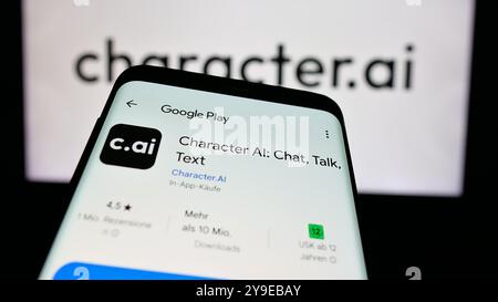 Smartphone with website of Character Technologies Inc. (Character.ai) on screen in front of business logo. Focus on top-left of phone display. Stock Photo