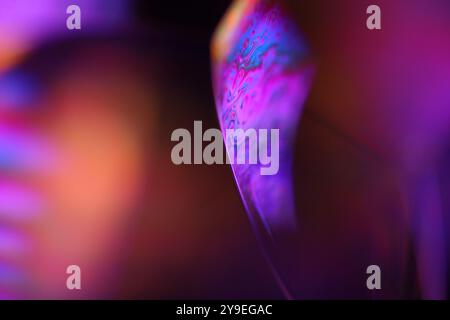 Purple and orange liquids, fluid circle, plasma, fluid movement, dark horror background, liquid in macro, fantastic movement Stock Photo