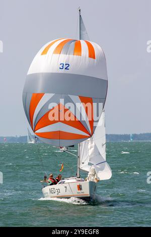 Cowes Week 2024 - IRC Class 7 yachts taking part in the regatta.  Yachts racing under spinnaker on a sunny summer day Stock Photo