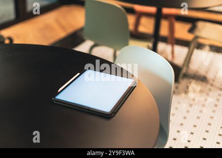 home kitchen office restaurant table graphic tablet reader white empty screen mockup Stock Photo
