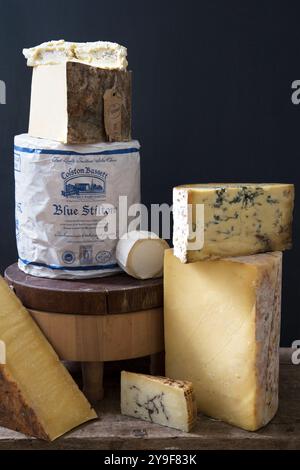 A mouthwatering selection of artisan cheeses featuring the world-famous Blue Stilton and a variety of aged, soft, and hard cheeses. Stock Photo