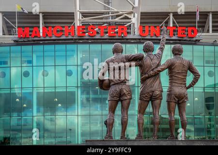 View of the United Trinity statue and Manchester United name at the main entrance of the Old Trafford stadium, Salford Stock Photo