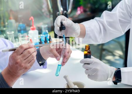 Team of researcher or scientists working in laboratory. Researcher or scientists working in laboratory. Researchers are inventing vaccines or medicine Stock Photo