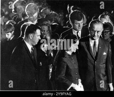 Arlington, Vereinigte Staaten. 27th July, 2009. Arlington, VA - (FILE) -- United States President Lyndon B. Johnson, far right, and first lady Lady Bird Johnson lead United States Senator Edward M. 'Ted' Kennedy (Democrat of Massachusetts), Mrs. Robert F. (Ethel) Kennedy, and Kennedy family and friends from the gravesite at the conclusion of funeral services for the late U.S. Senator Robert F. Kennedy on June 9, 1968.Credit: Arnie Sachs/CNP/dpa/Alamy Live News Stock Photo