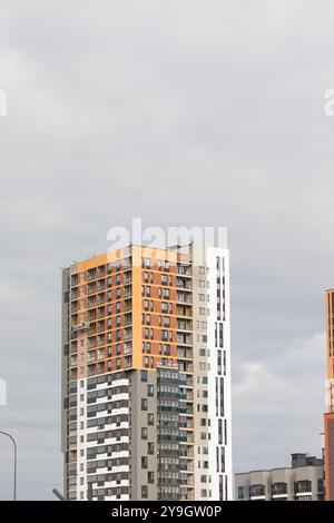 Curated visual reference: Visual Reference: Tall Modern Apartment Buildings Dominate The Skyline In This