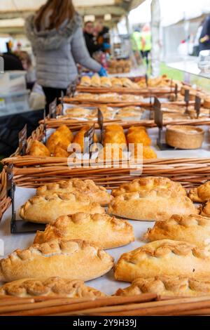 Baskets of Cornish pasties and other baked food on sale in a makers market Stock Photo