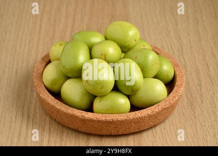 Green immature jujube Ziziphus jujuba fruits, red dates, Indian dates or Chinese dates still life Stock Photo