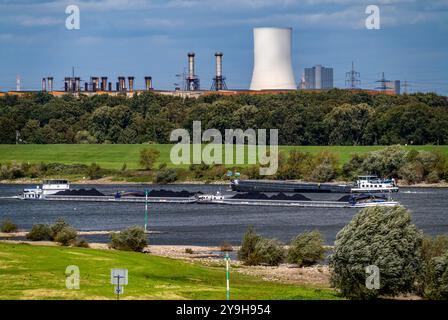 Rhine at Duisburg-Beeckerwerth, freighter loaded with coal, cooling tower of the STEAG coal-fired power plant Walsum, hot strip mill II, industrial sc Stock Photo