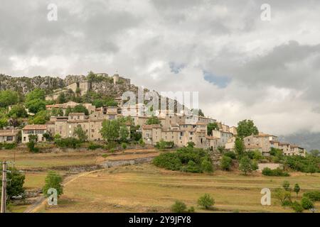 Medieval Village of Trigance in the Verdon Region, with 11th century Château de Trigance and surrounded by Scenic Provençal Countryside on cloudy day Stock Photo