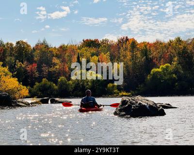 Kayaking on the lake at fall - outdoor leisuring Stock Photo