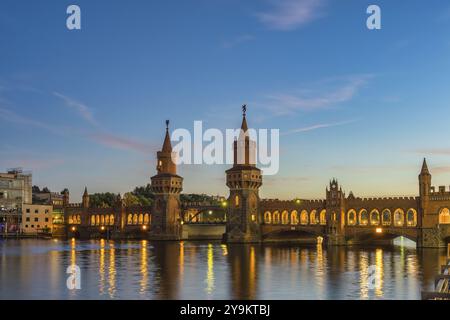 Berlin Germany, sunset city skyline at Oberbaum Bridge and Spree River Stock Photo