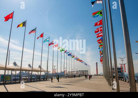 FEBRUARY 8, 2022, QINGDAO, CHINA: The flag alley and the Olympic light around Qingdao Marina, China Stock Photo