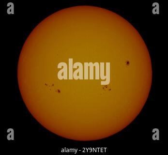 London, UK. 11th Oct, 2024. Image of the Sun with the large sunspot (right) responsible for Northern Lights seen over much of the UK on 10th October. This sunspot is now moving away from Earth facing but with a new group (left) gradually revolving round towards Earth. Credit: Malcolm Park/Ģ����ý Live News Stock Photo