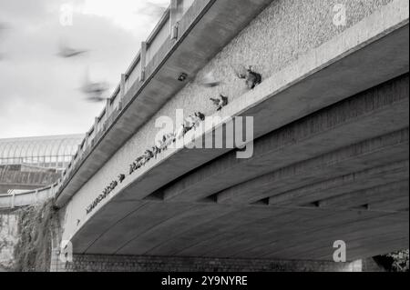 Pigeons lined up un the arch of a bridge in Maidstone, Kent, UK Stock Photo