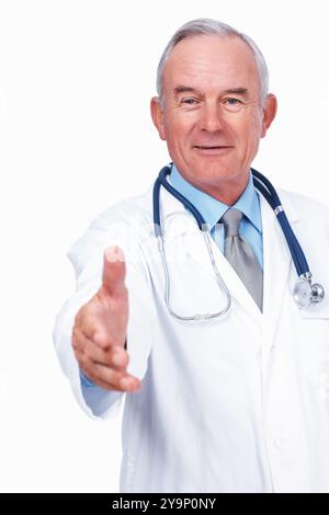Medical, handshake and portrait of mature man in studio for healthcare, consultant and medicine. Doctor, cardiologist and welcome pov with person on Stock Photo