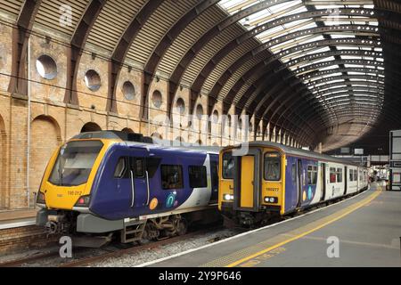 Northern Rail class 195 diesel multiple unit 195012, and class 150 number 150277, waiting at York station, UK. Stock Photo