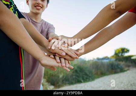 Friends hands stacking together teamwork, unity and collaboration Stock Photo
