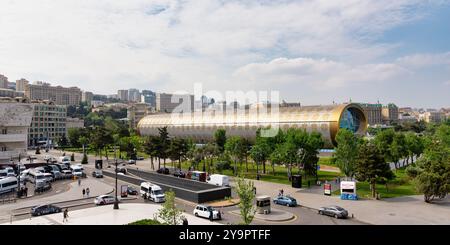 Baku, Azerbaijan - May 4 2024: The Azerbaijan National Carpet Museum showcases unique architecture, amidst a vibrant urban landscape Stock Photo