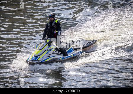 Berlin, Germany. 11th Oct, 2024. A Berlin police officer from the water police rides a jet ski on the Spree and secures the meeting between Federal Chancellor Scholz (SPD) and Selenskyj, President of Ukraine, Federal Chancellery. Ukrainian President Selenskyj is expected to pay a one-day visit to Germany. Credit: Michael Kappeler/dpa/Alamy Live News Stock Photo