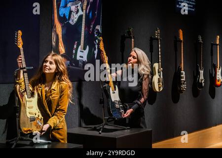 London, UK. 11th Oct, 2024. Rory Gallagher's legendary 1961 Fender Stratocaster, which has an estimate of £700,000 - 1,000,000 with a Fender Esquire Electric Guitar (R), 1959. Estimate: £80,000 - 120,000 - The Rory Gallagher Collection at Bonhams New Bond Street, London. The property of the Irish musician and songwriter will be on view to the public from 12-17 October and the sale will take place on 17 October. Credit: Guy Bell/Alamy Live News Stock Photo