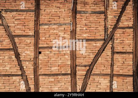 Old timbered rural brick house wall texture closeup as background Stock Photo