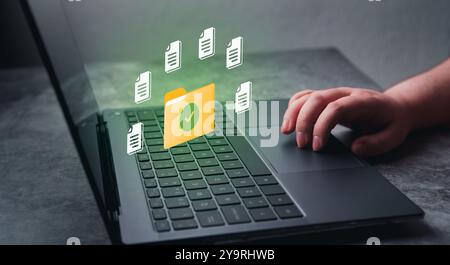 Woman hand on laptop for DMS concept. Document Management System. Software to store, organize and manage digital documents. Stock Photo