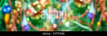 santa claus with white beard, blurred colorful decorations, blur background, peaceful christmastime Moments, Bokeh effect with garlands, nostalgic hol Stock Photo
