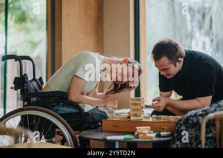 Inclusive playtime with children and elderly woman using building blocks Stock Photo