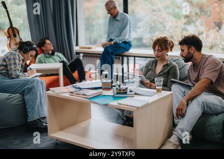 Professor engaging with attentive students in relaxed classroom setting Stock Photo