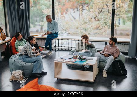 Professor engaging with students in a modern learning space Stock Photo