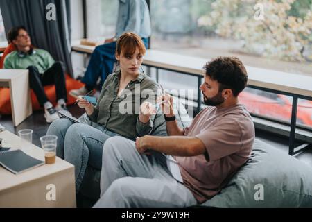 Students engaged in discussion during study group session Stock Photo