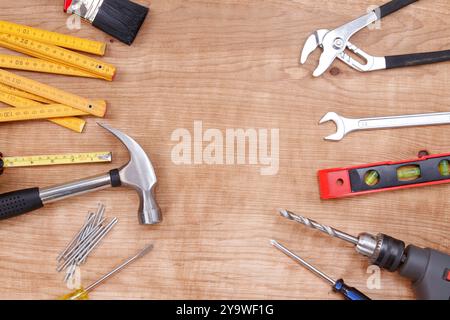Assorted work tools on wood Stock Photo