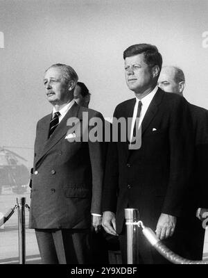 U.S. President John F. Kennedy attending arrival ceremonies in honor of British Prime Minister Harold Macmillan (left), Andrews Air Force Base, Prince George's County, Maryland, USA, Abbie Rowe, White House Photographs, April 27, 1962 Stock Photo