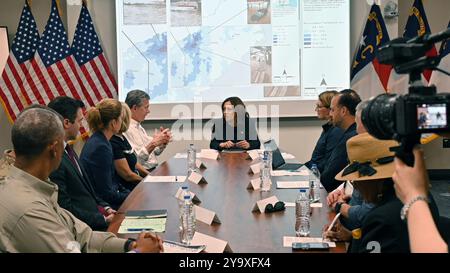 Charlotte, United States. 05 October, 2024. U.S Vice President Kamala Harris, center, participates in a briefing with North Carolina Governor Roy Cooper, left, on relief and recovery efforts in the aftermath of Hurricane Helene at the North Carolina Air National Guard Base, October 5, 2024 in Charlotte, North Carolina.  Credit: TSgt. Juan Paz/US Air Force Photo/Alamy Live News Stock Photo