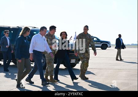 Charlotte, United States. 05 October, 2024. U.S Vice President Kamala Harris, right, and North Carolina Gov. Roy Cooper, left, walk together on the way to view the aftermath of Hurricane Helene at Charlotte-Douglas International Airport, October 5, 2024 in Charlotte, North Carolina.  Credit: TSgt. Juan Paz/US Air Force Photo/Alamy Live News Stock Photo