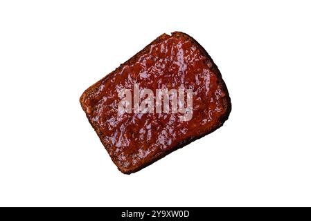 Sandwiches with toast bread, peanut butter and raspberry or strawberry jam. Hearty, nutritious breakfast Stock Photo