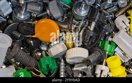 Computer fasteners hardware assorted odds and ends technology background. Stock Photo