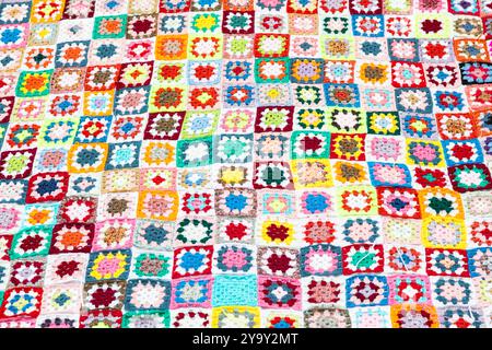 Multi colored blanket in wool, geometric background, retro decorative pattern Stock Photo