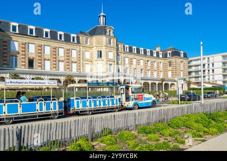 France, Loire Atlantique, Pornichet, searesort of the Côte d'Amour, touristic train in front of the Grand Hôtel de l’Océan opened in 1882 Stock Photo