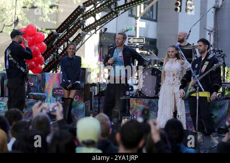 New York City. 08th Oct, 2024. NEW YORK, NEW YORK - OCTOBER 08: Chris Martin of Coldplay performs live on NBC's 'Today' show at Rockefeller Plaza on October 08, 2024, in New York City. The British rock band delivered an energetic performance, captivating the audience with their hit songs. Fans gathered early in the morning to witness the event, braving the fall weather for a chance to see Coldplay live in action. (Credit: Giada Papini/EuropaNewswire)/dpa/Alamy Live News Stock Photo