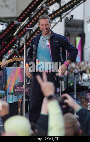 New York City. 08th Oct, 2024. NEW YORK, NEW YORK - OCTOBER 08: Chris Martin of Coldplay performs live on NBC's 'Today' show at Rockefeller Plaza on October 08, 2024, in New York City. The British rock band delivered an energetic performance, captivating the audience with their hit songs. Fans gathered early in the morning to witness the event, braving the fall weather for a chance to see Coldplay live in action. (Credit: Giada Papini/EuropaNewswire)/dpa/Alamy Live News Stock Photo